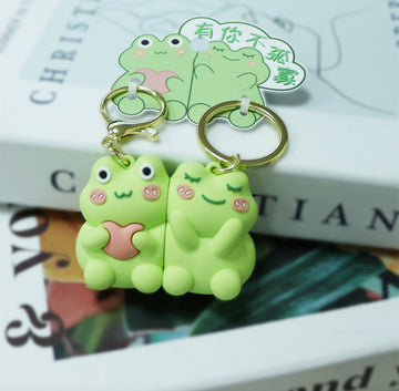 Pair of magnetic keychains featuring "Froglets"