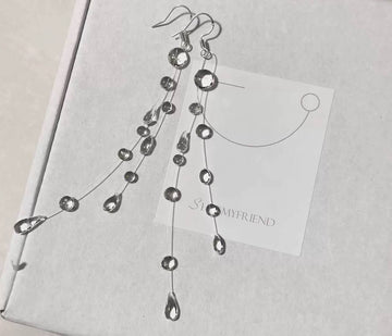 Long earrings adorned with sparkling clear crystals