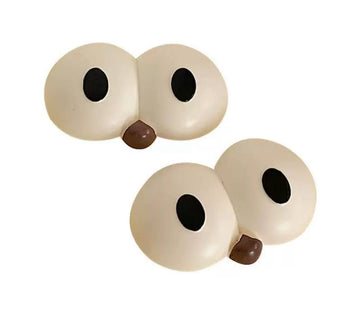 Eye-shaped jibbits with a little nose for Crocs