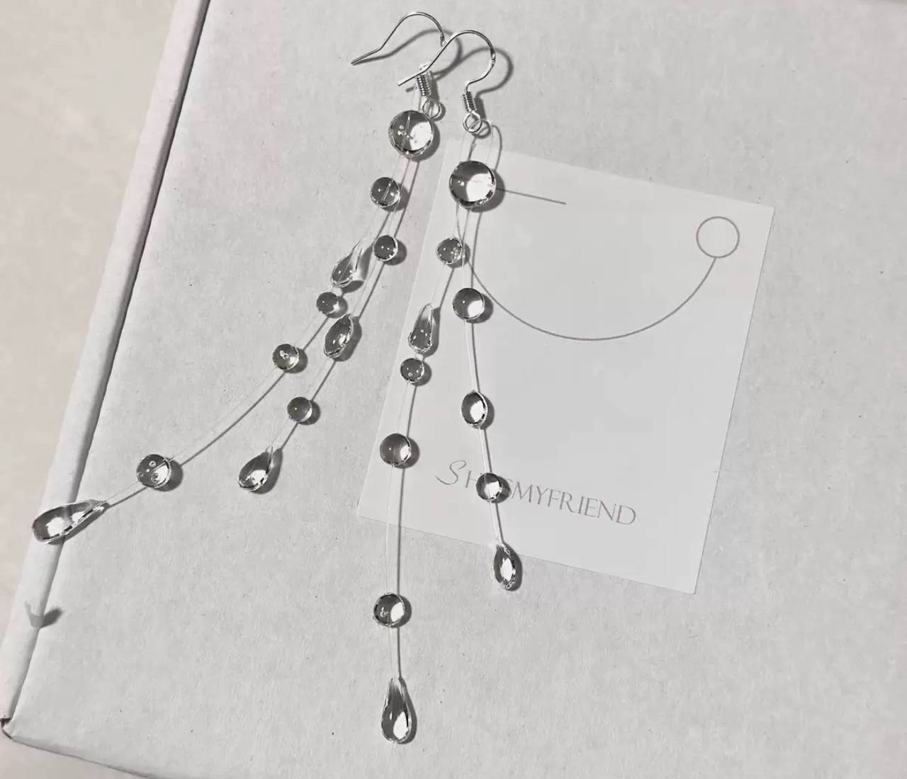 Long earrings adorned with sparkling clear crystals